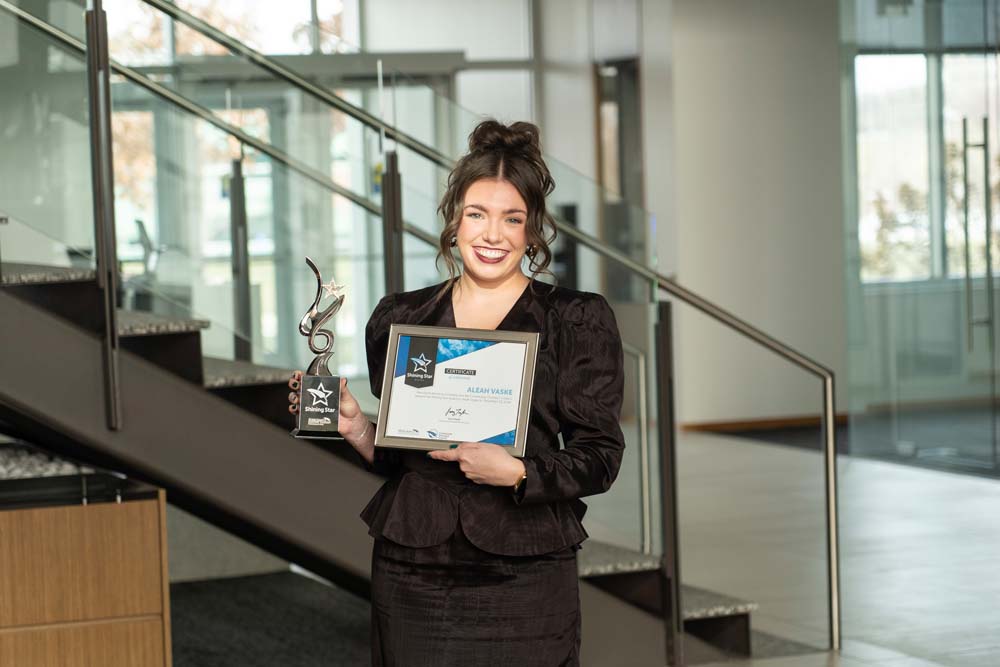 Shining Star winner Aleah Vaske holding certificate