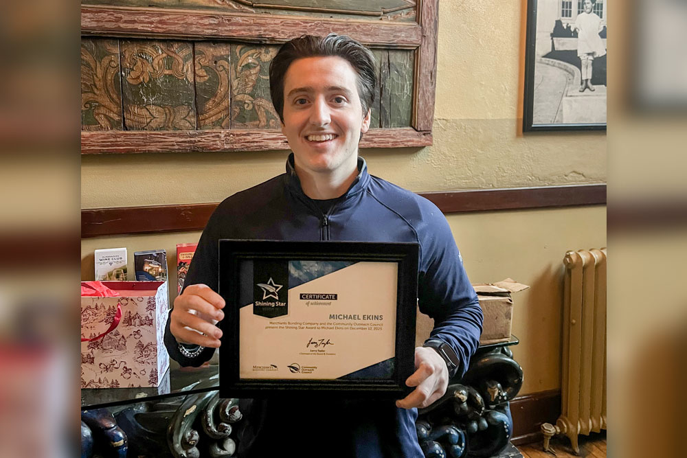 Shining Star runner-up Michael Ekins holding certificate